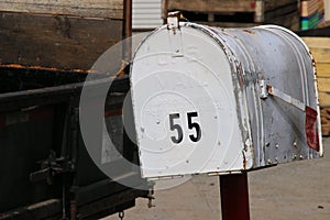 Weathered and rusted mail box.