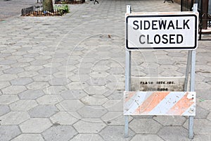 Weathered Sidewalk Closed Sign with Concrete Pavers