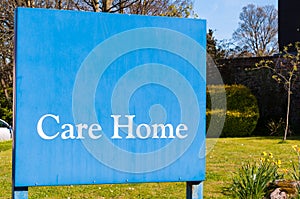 Weathered Sign for elderly people 'Care Home' at the entrance of