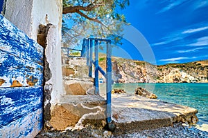 Weathered stairway to sea waters of bay on Greek island on sunny day.