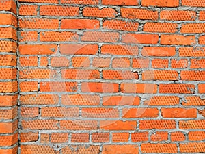 Weathered texture of stained old dark brown and red brick wall background, grungy rusty blocks