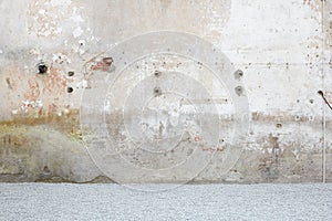 Weathered wall with gravel, stone chippings floor