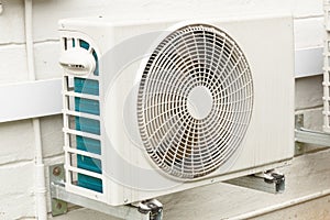 Weathered White Airconditioning Unit Mounted on Exterior Home Wa