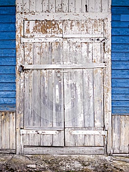 Weathered white painted door with flaked paint