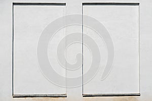 Weathered white stucco wall with a stucco frame