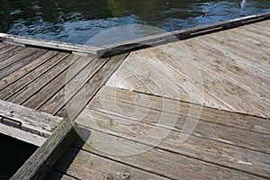 Weathered wooden boardwalk with three converging paths