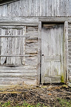 weathered wooden door and wall or abandoned farm shed