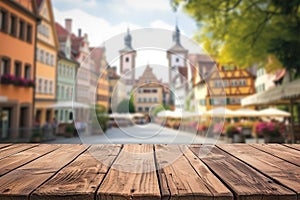 Weathered wooden product display with european old town on background on background