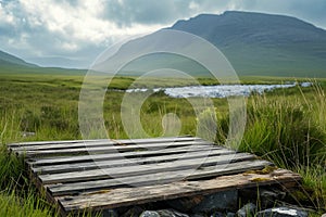 Weathered wooden product display with Irish highlands on background