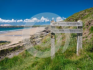 Weathered wooden sign on the Pembrokeshire Coast Path