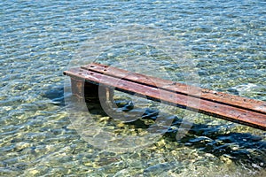 Weathered wooden small pier over the sea at Kea, Tzia island, Greece