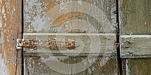 Weathered wooden window shutters closeup.