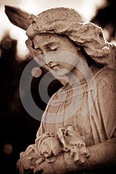 Weathered young angel in sepia