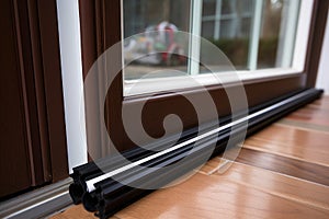 weatherstrip adhesive applied to a house door