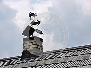 Weathervane on old smokestack