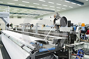 Weaving automatic machines - Weaving is a method of textile production in which two distinct sets of yarns or threads are