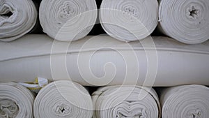 Weaving of fabric on cars. Production of fabric from threads at factory. Textile factory industry. Fabric making machines.