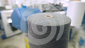 Weaving factory for the production of textile products. Large spools of thread in production