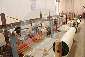 Weaving or Handloom Industry in India. Textile handicraft artisans. Spinning Cotton into thread.