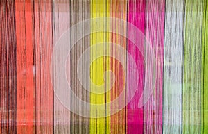 Weaving loom and shuttle on the warp