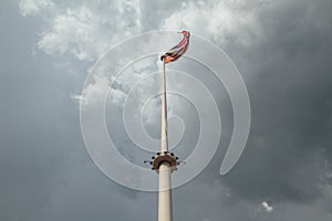 Weaving Malaysia flag with cloudy sky in Kuala Lumpur, Malaysia