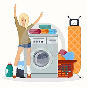 Happy woman next to laundry equipment. Working washing machine with linen baskets, detergent, ironing board and towels