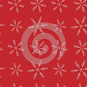 Christmas and New year seamless pattern. White snowflakes at the red background.