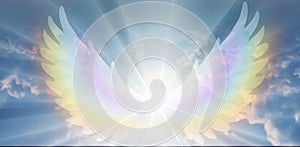 Spiritual guidance, Angel of light and love doing a miracle on sky, rainbow angelic wings