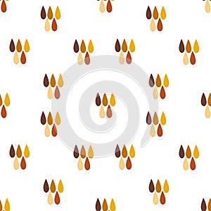 Seamless pattern of hand drawn raindrops in honey, yellow and brown colors on white background