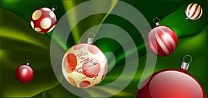 Red Christmas tree balls on green silk. Christmas holiday backdrop