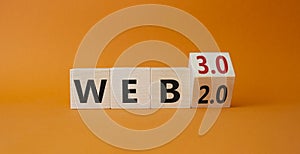 Web 3.0 vs Web 2.0 symbol. Turned wooden cubes with words web 2.0 to web 3.0. Beautiful orange background. Business concept. Copy