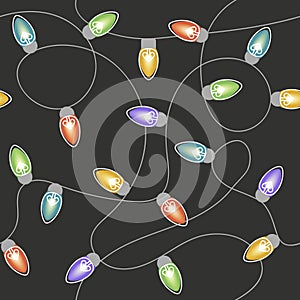 Vector seamless pattern featuring colorful string lights on a dark background