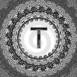 Stylized circular design featuring a bold letter 