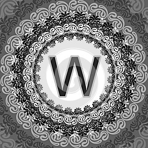 Stylized circular design featuring a bold letter 