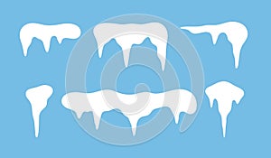 Set of frozen white icicles with a snow cap, isolated on a blue background, vector illustration, flat design