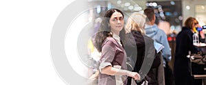 Web banner of Black fraday sale. Portrait of young Caucasian smiling woman looking back and standing in store queue to