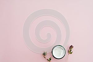 Web banner. Skin cream and dry flowers, leaves. White table background. Organic cosmetics, spa concept. Empty space, flat lay, top