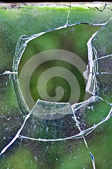 A web in a broken glass of a windows photo