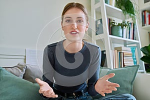 Web camera view of teenage girl talking looking in camera, online meeting, video call