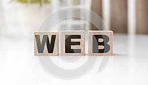WEB concept text on wooden cubes on a white background