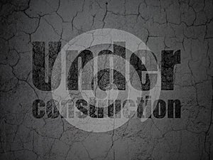 Web design concept: Under Construction on grunge wall background