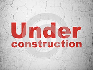 Web design concept: Under Construction on wall background