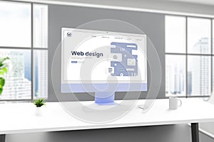 Web design studio ambiance with a computer display showcasing a conceptual web design page