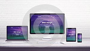 Web design studio concept with flat design responsive web site on display devices