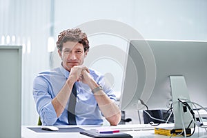 Web designer, computer and portrait with office, work and company support with technology. Man, suit and desk with