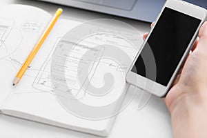 Web designer creating mobile user interface