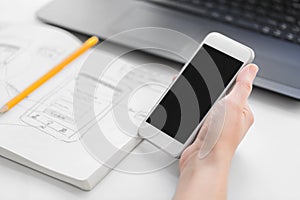 Web designer creating mobile user interface