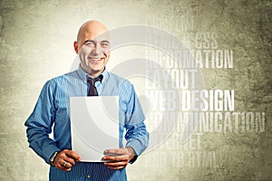 Web designer holding paper photo