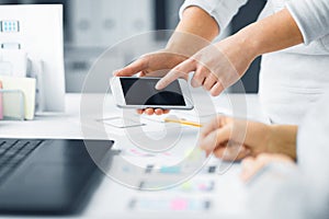 Web designers creating mobile user interface