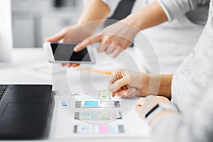 Web designers creating mobile user interface